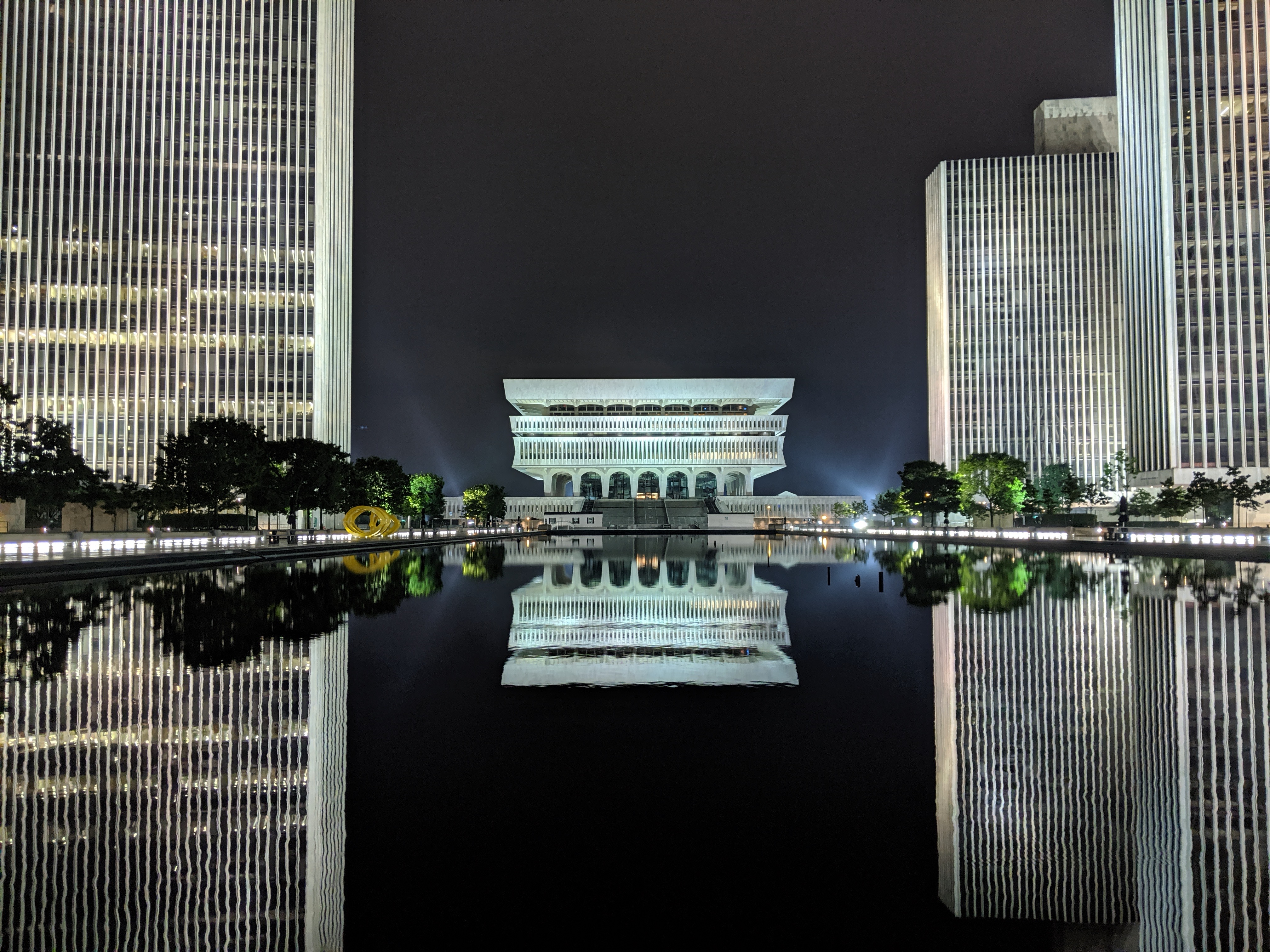 Empire State Plaza buildings and reflecting pool at night